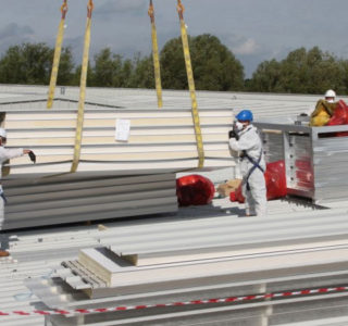 Workers replacing an asbestos roof